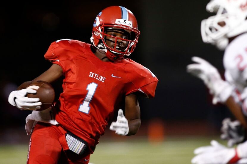 Skyline quarterback Velton Gardner (1) carries the ball against Duncanville in the second...