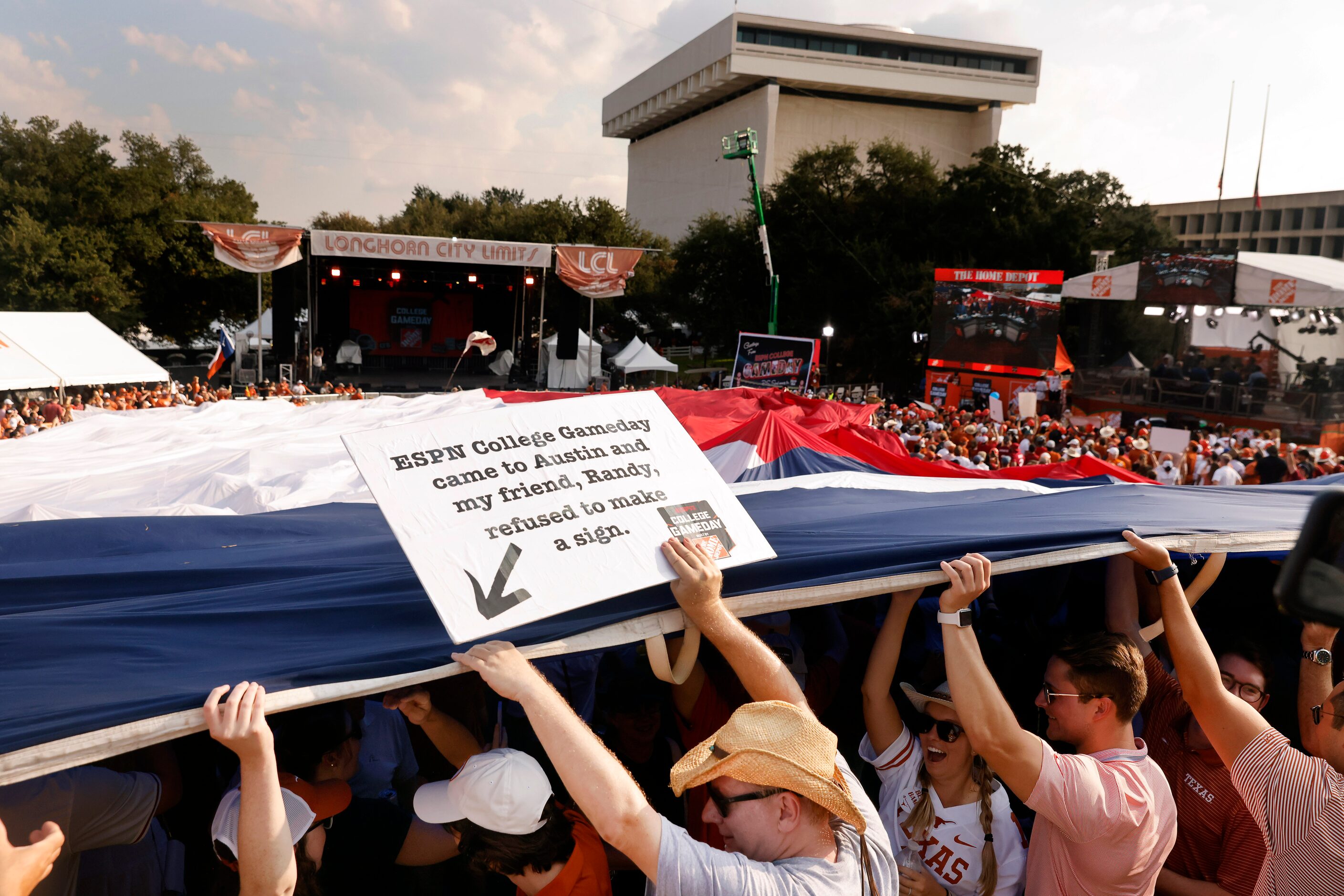 Texas Longhorns fans pass a field-sized Texas flag across the ESPN College GameDay crowd...