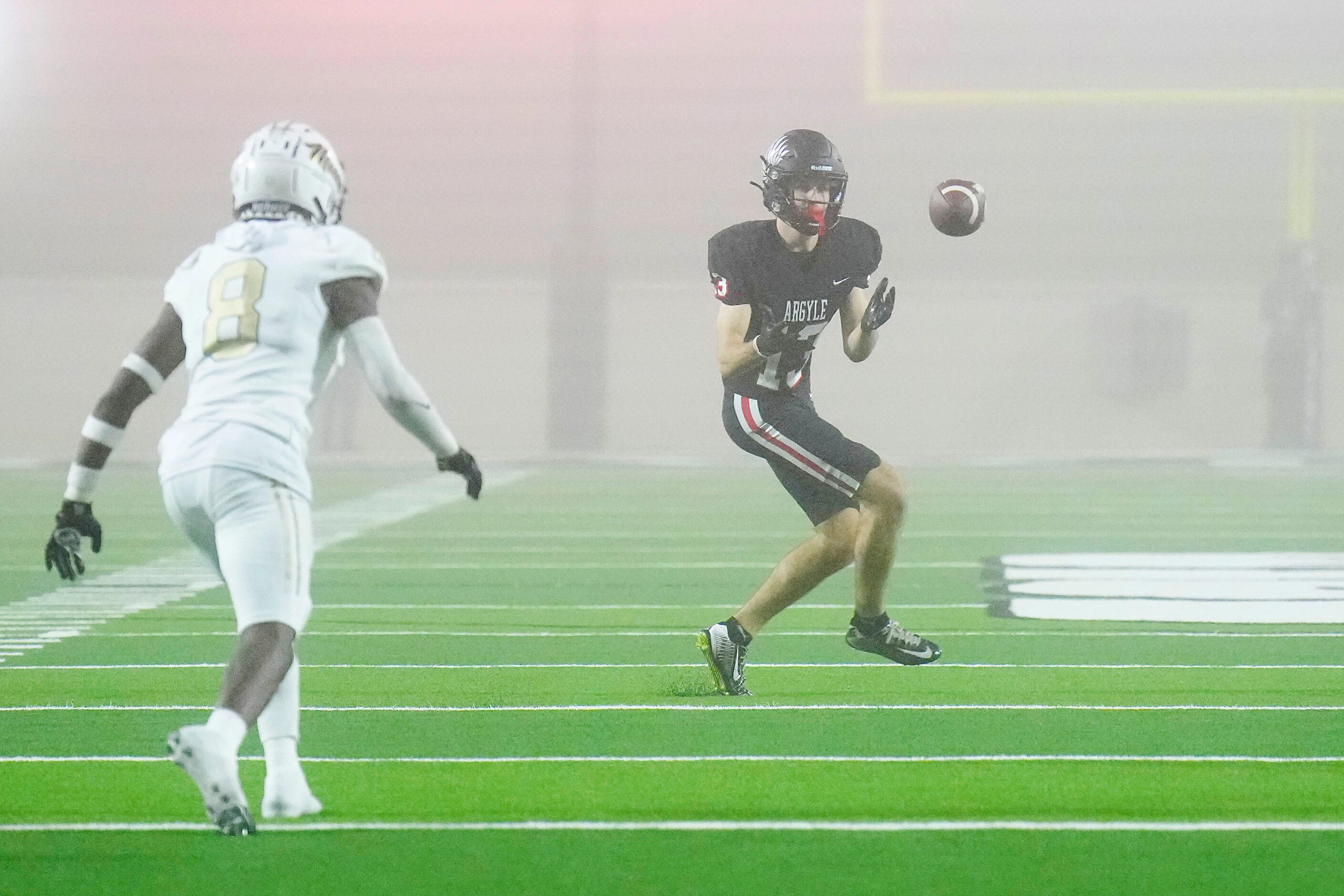 Argyle’s Will Krzysiak (13) makes a catch past South Oak Clif’sf Brandon Jones (8) during...