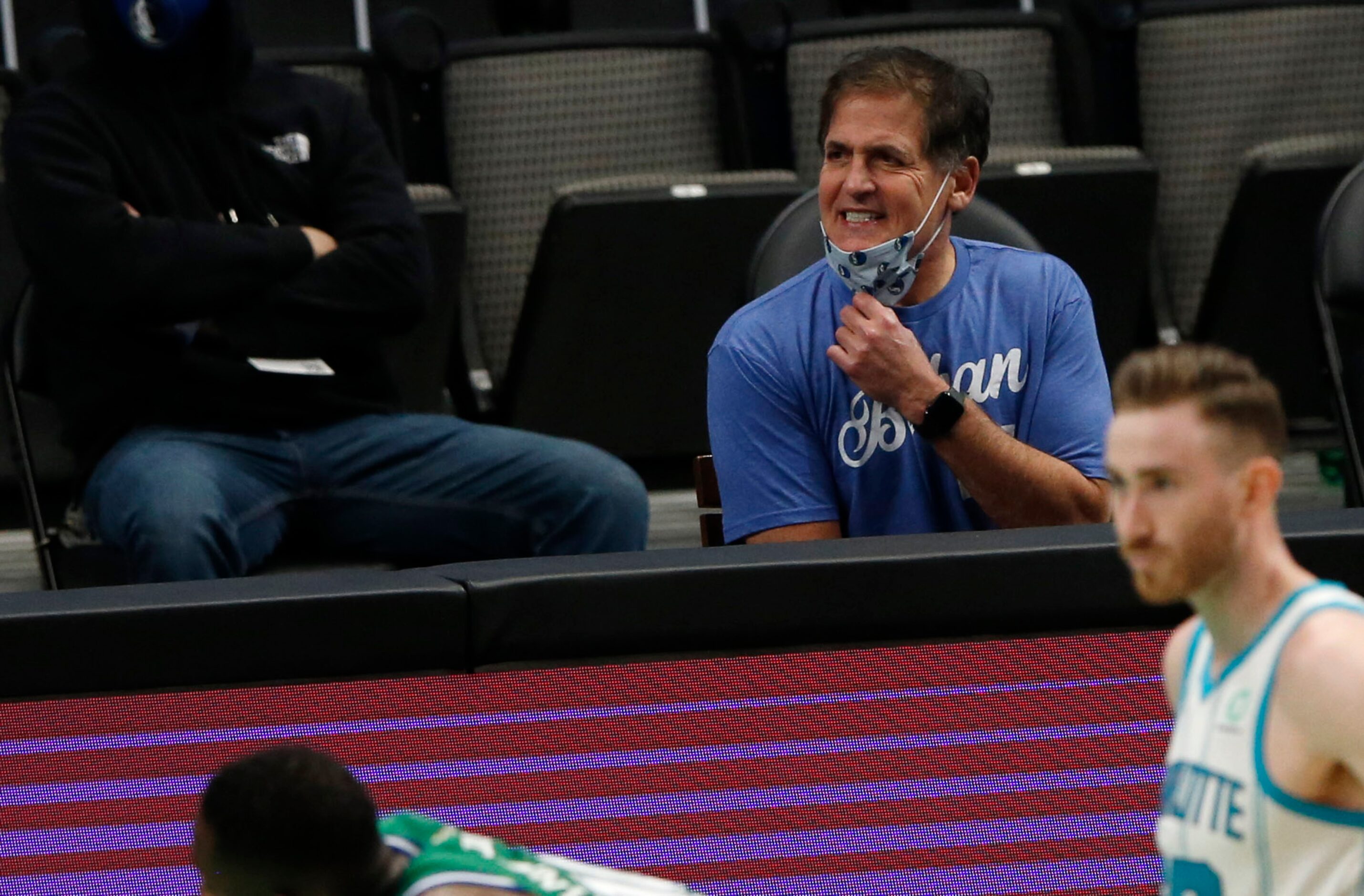 Dallas Mavericks owner Mark Cuban questions a call as they play the Charlotte Hornets during...