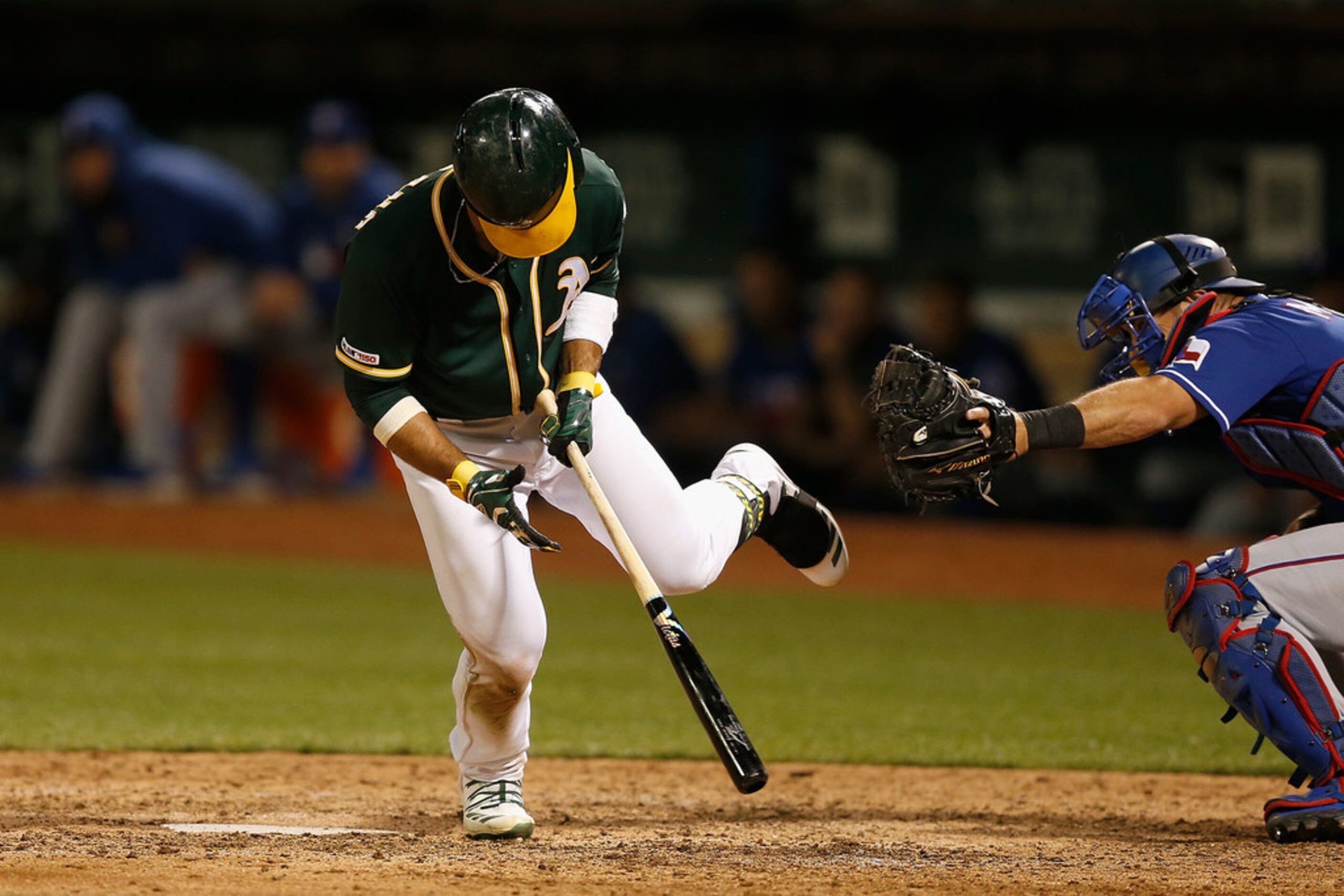 OAKLAND, CALIFORNIA - JULY 27: Ramon Laureano #22 of the Oakland Athletics is hit by a pitch...