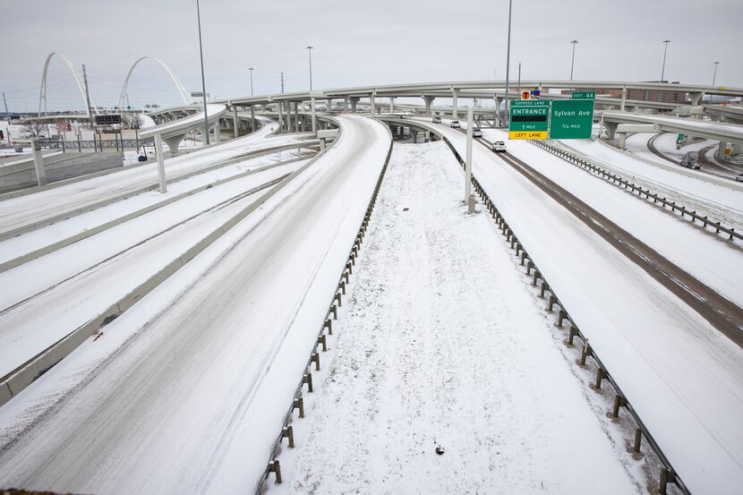 Snow covers I-30 and I-35E close to Downtown Dallas on Monday.
