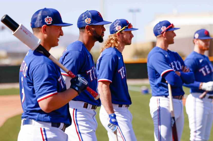 From left, Texas Rangers infielder Mark Mathias, outfielders Leody Taveras, Travis...