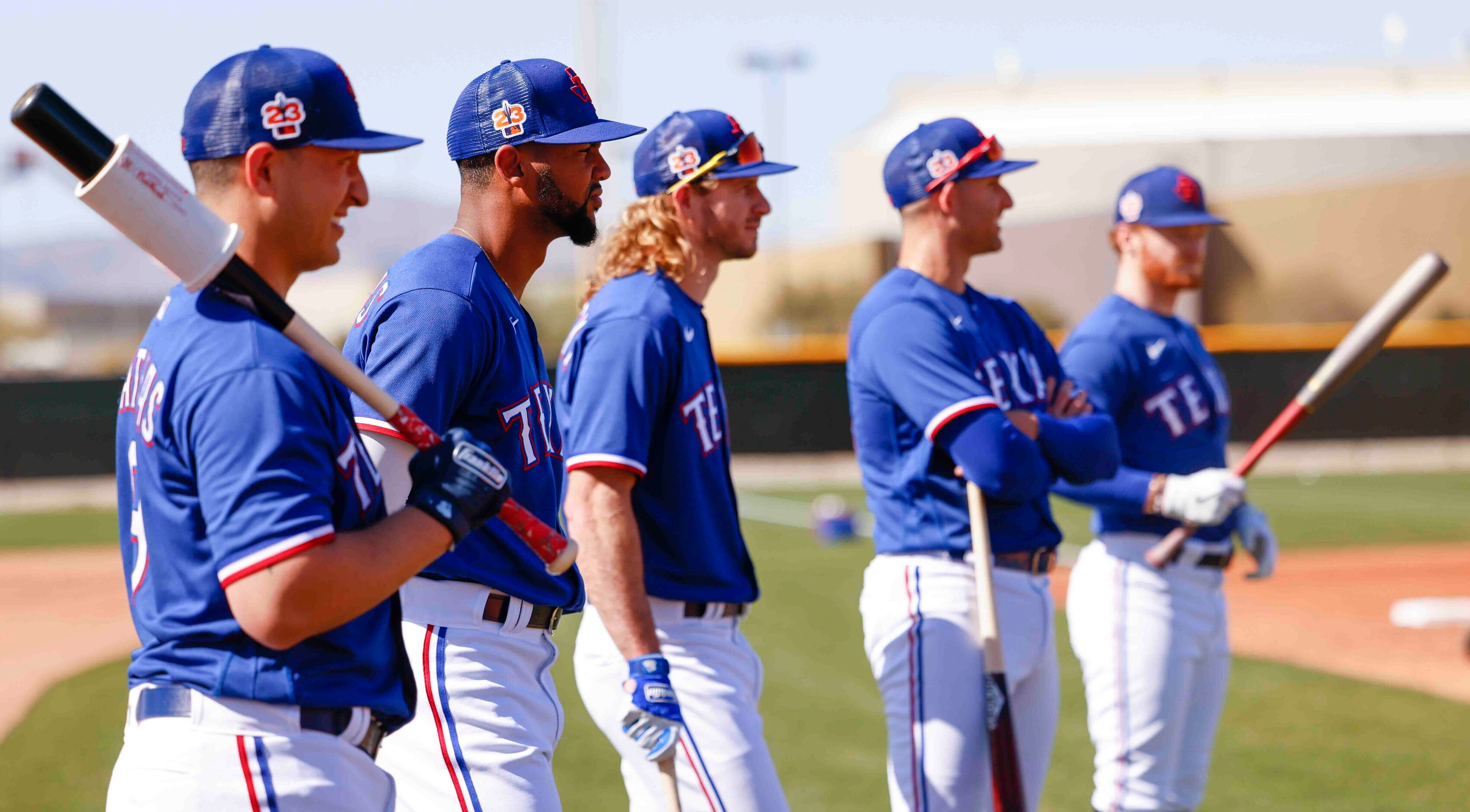 From left, Texas Rangers infielder Mark Mathias, outfielders Leody Taveras, Travis...