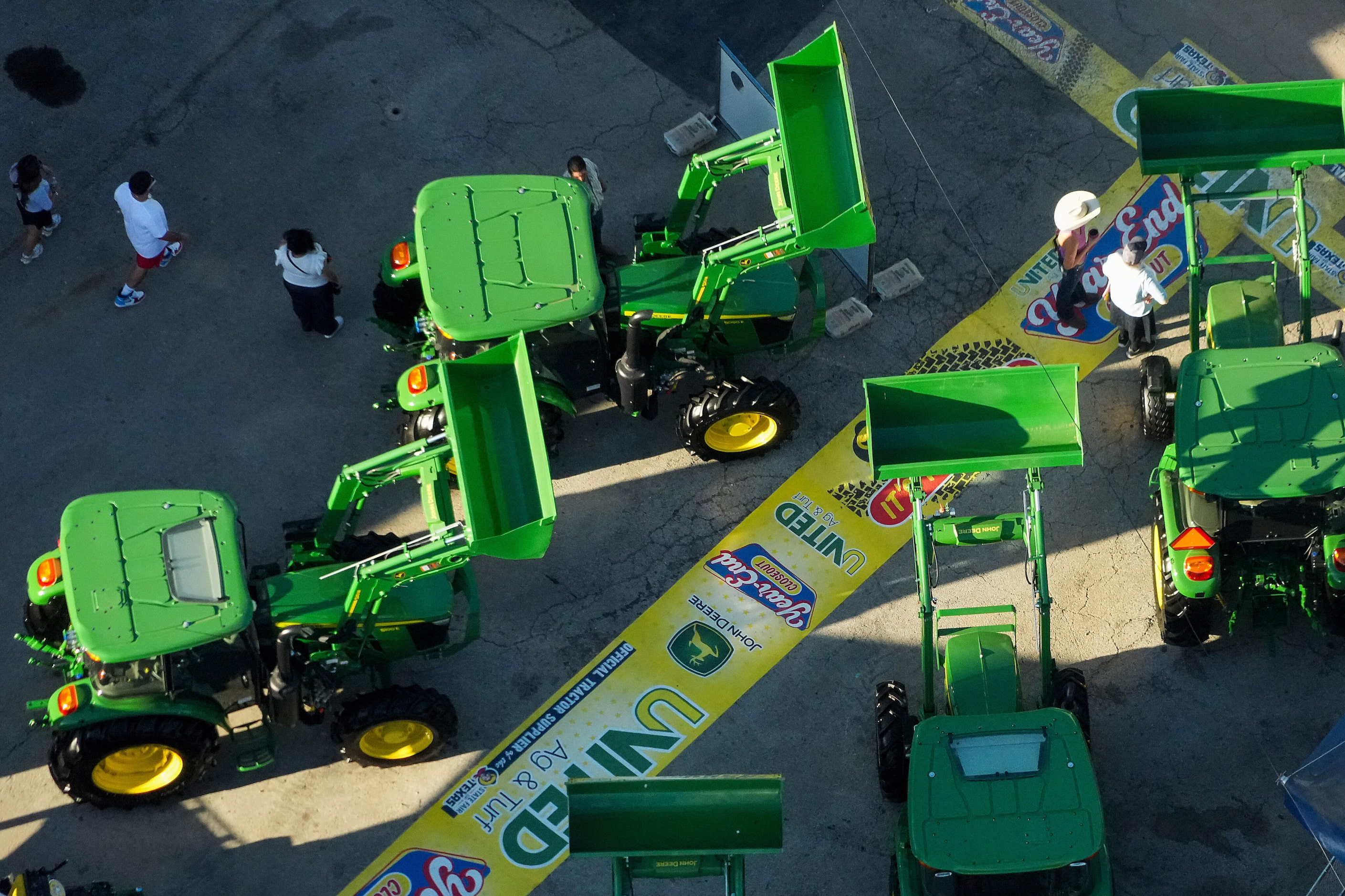 Tractors are seen at the entrance to the United Ag & Turf booth at the State Fair of Texas...