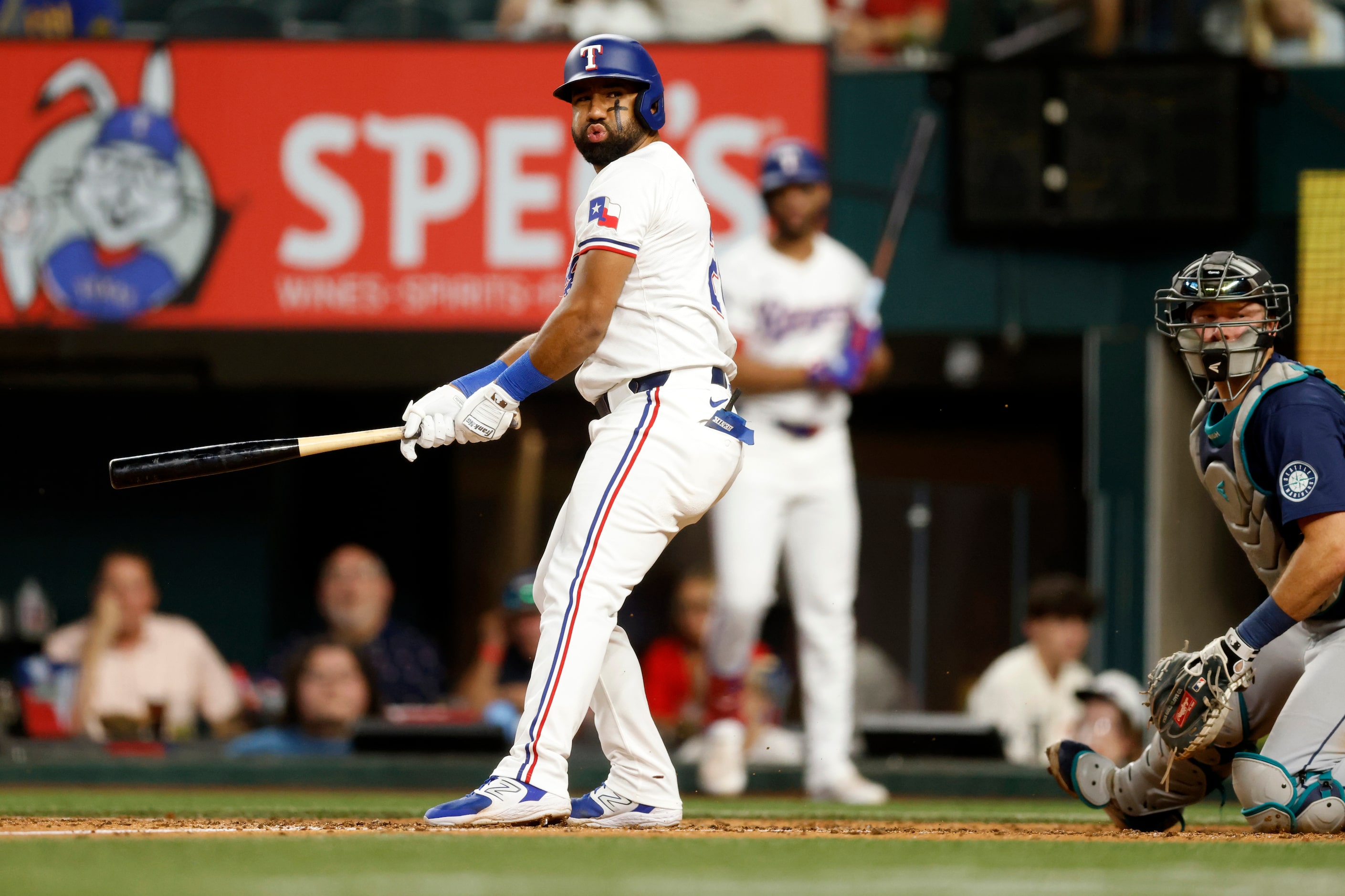 Texas Rangers third baseman Ezequiel Duran (20) reacts after a swing and miss during the...