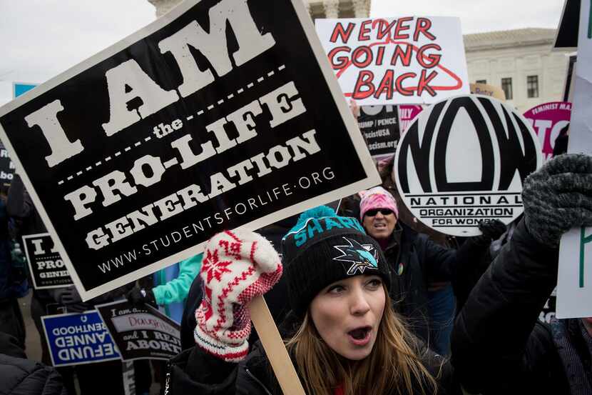 A mix of protesters for and against abortion rights rallied outside of the Supreme Court...