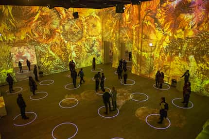 At 'Immersive Van Gogh' in Chicago, attendees stood on designated circles to stay socially...