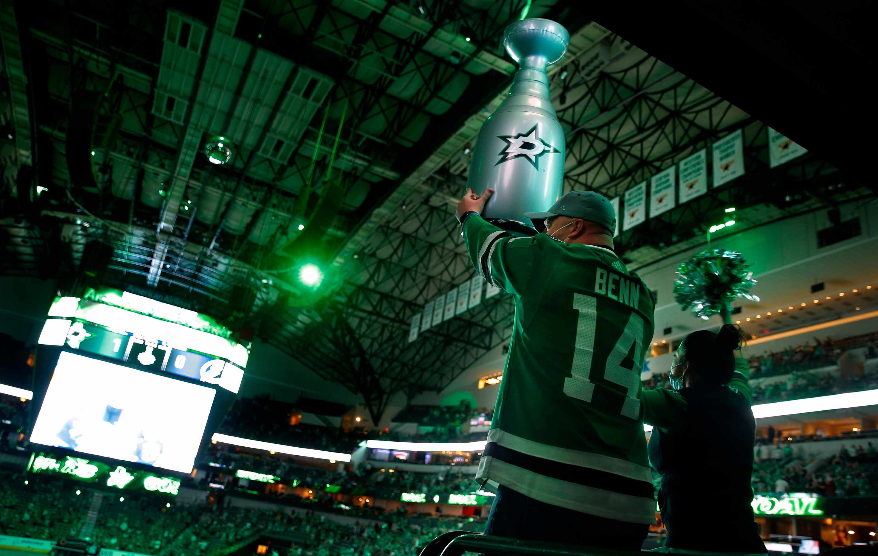 At a Stanley Cup Finals watch party, Dallas Stars fan Bobby Hawkins of Arlington raises his...