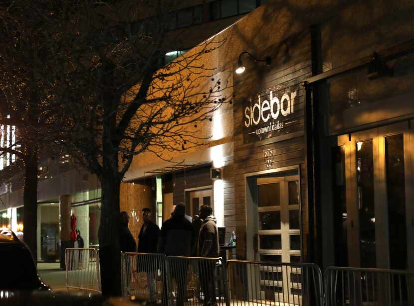 Doormen wait outside in preperation for a line of Uptown partiers at Sidebar in Dallas, TX,...