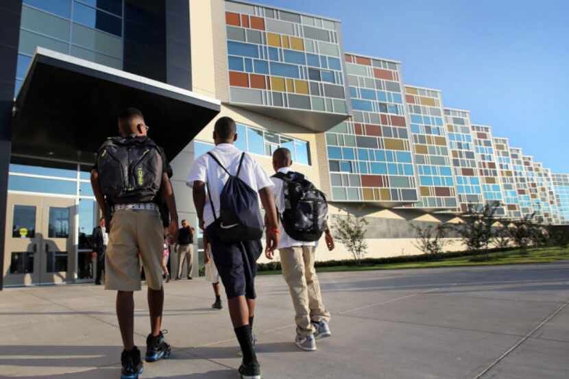 Students arrive for the first day of school at the new Billy Earl Dade Middle School near...