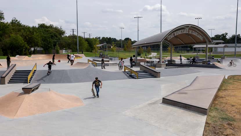 People skateboard at the Jon Comer Skatepark, Saturday, Sept. 16, 2023, in Garland, Texas.