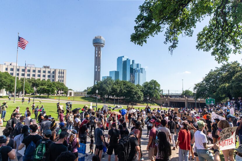 Protesters assemble at the grassy knoll on June 3 during a demonstration denouncing police...