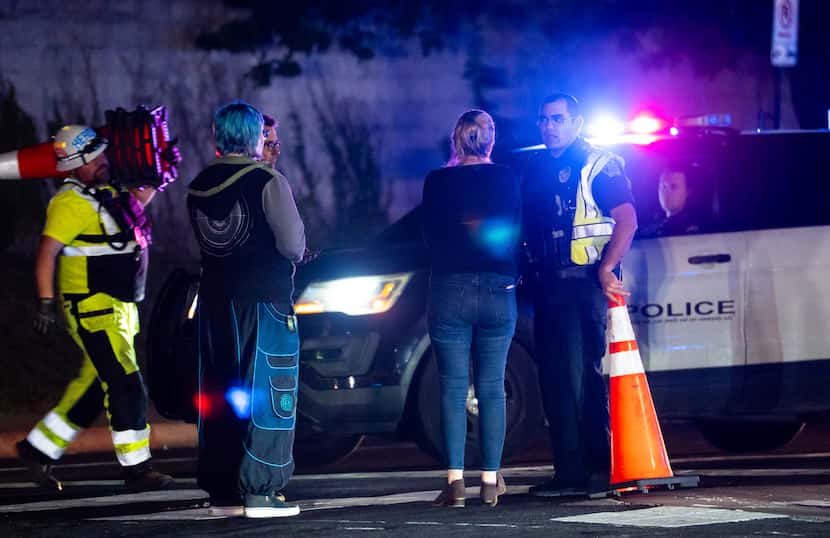 Neighborhood residents speak to Austin Police officers in Austin, Texas late Tuesday, Dec....
