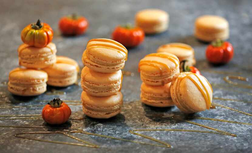 Pumpkin Spice Caramel Macarons are drizzled with caramel sauce.