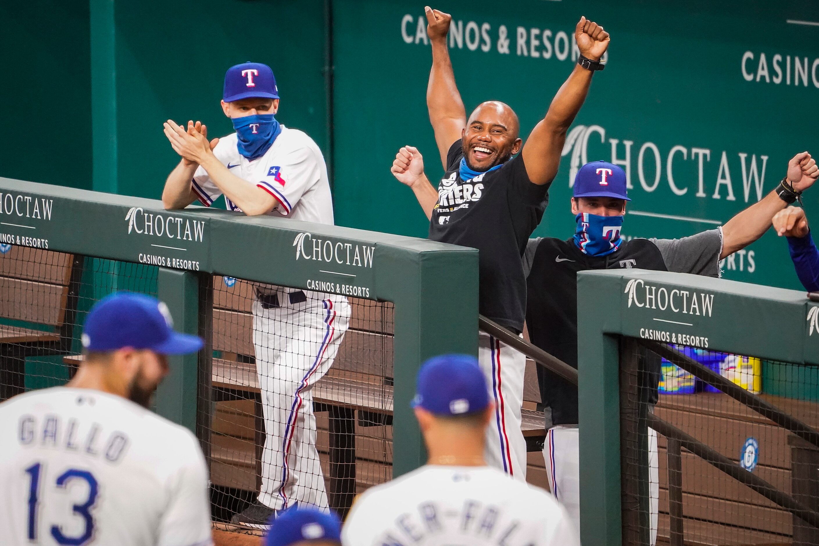 Texas Rangers assistant hitting coach Callix Crabbe (center) cheers right fielder Joey Gallo...