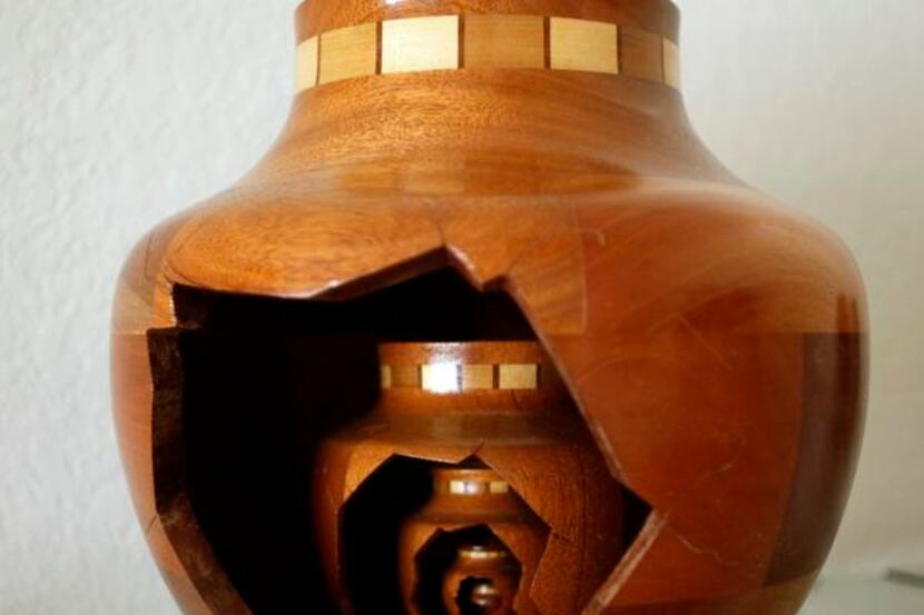 An untitled piece made from Mahogany and Tulip Poplar woods by Murray Stein, of Allen, which...