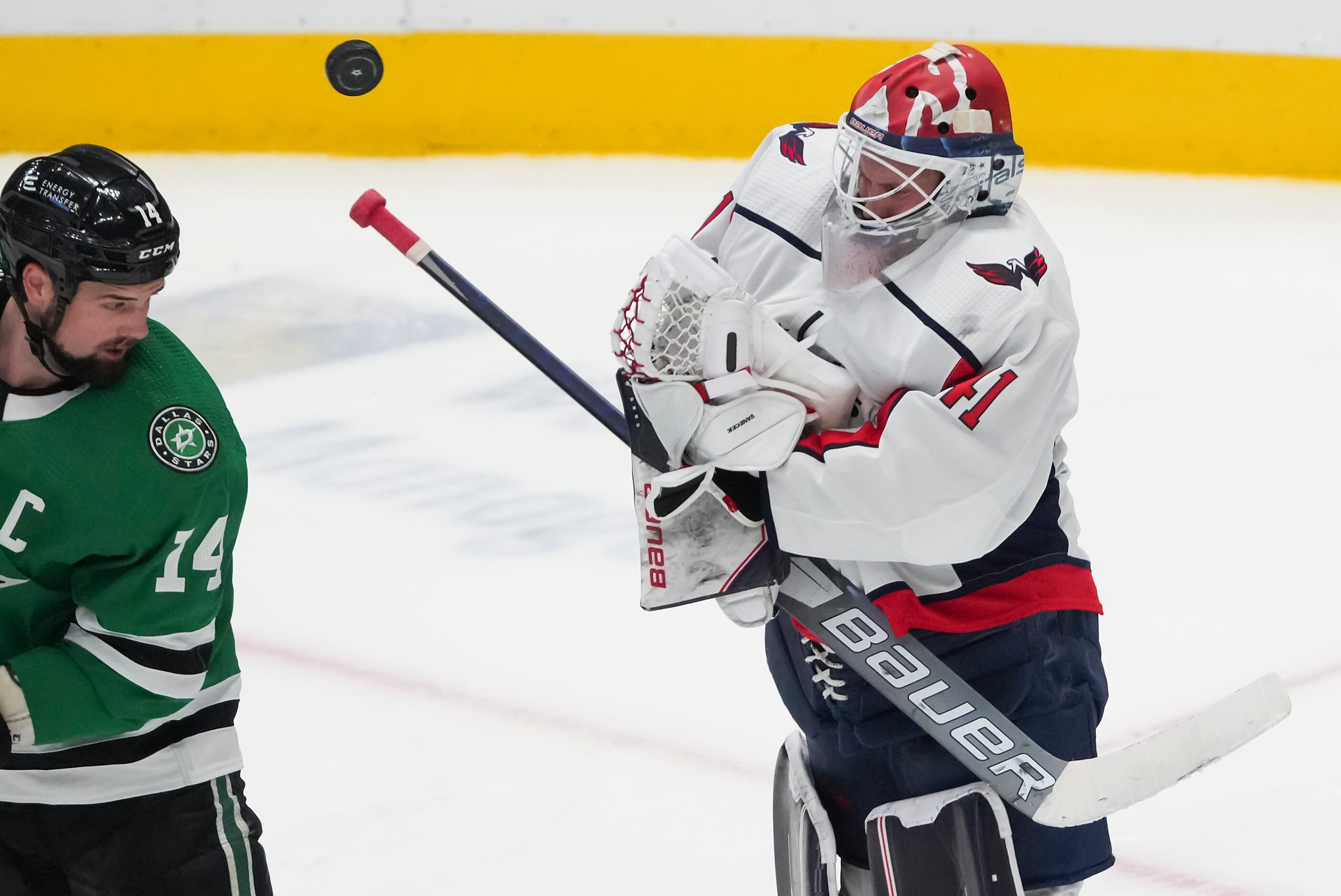 Washington Capitals goaltender Vitek Vanecek (41) knocks away a high puck in front of Dallas...