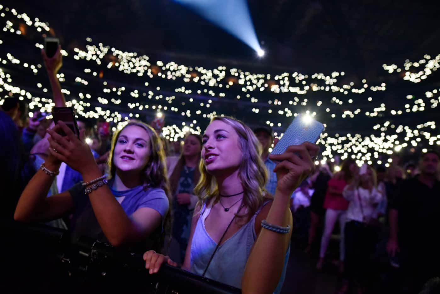Fans fill the AAC with cell phone lights as Ed Sheeran performs at the American Airlines...