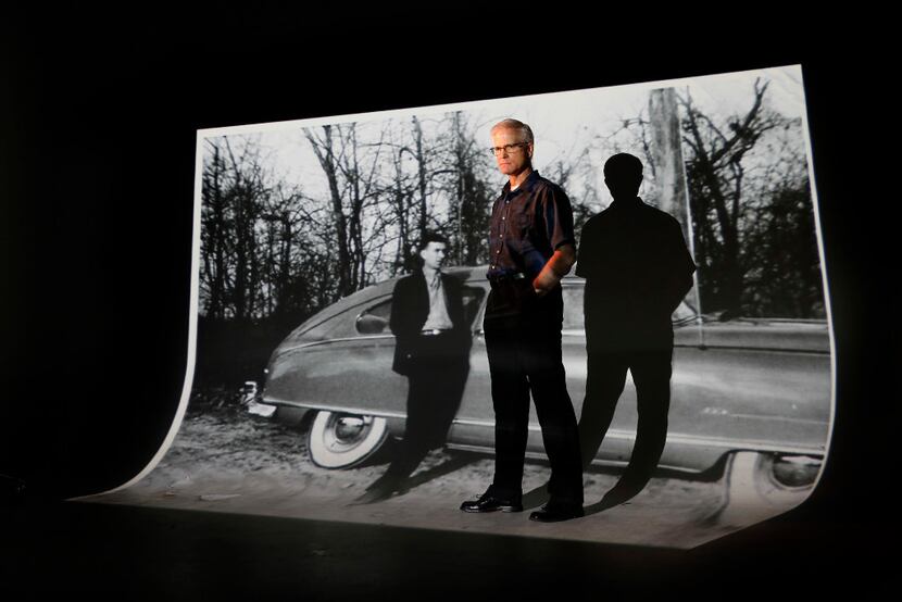 Dallas Morning News multiplatform editor Frank Christlieb stands before a large projection...