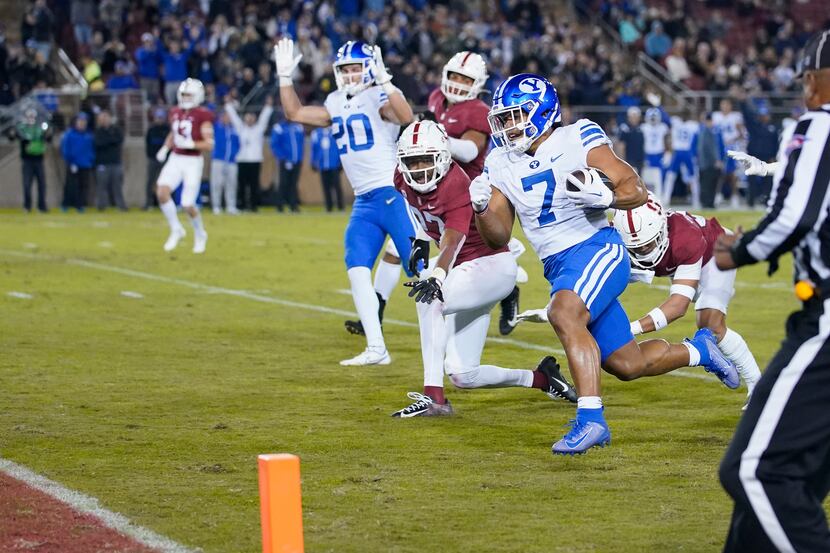 FILE - BYU running back Hinckley Ropati (7) heads to the end zone on a 43-yard touchdown...