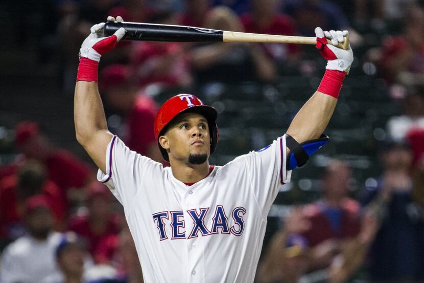 Texas Rangers left fielder Carlos Gomez (14) reacts to striking out during the eighth inning...
