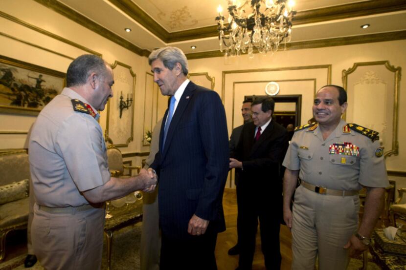 U.S. Secretary of State John Kerry, was escorted by Gen. Abdel-Fattah el-Sissi  (right) in...