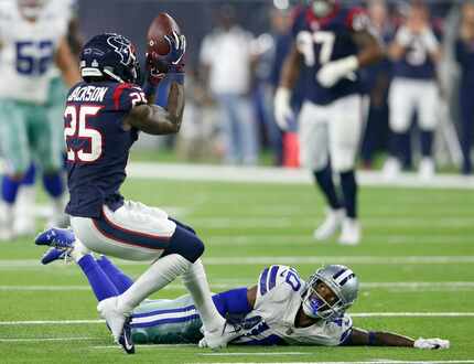 Houston Texans strong safety Kareem Jackson (25) intercepts a pass intended for Dallas...