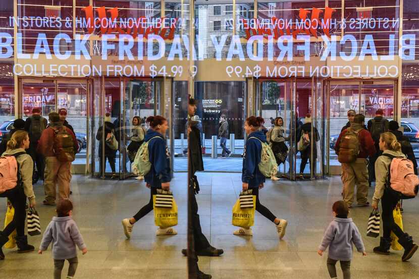 NEW YORK, NY - NOVEMBER 24:  People shop at a H&M store on "Black Friday" on November 24,...