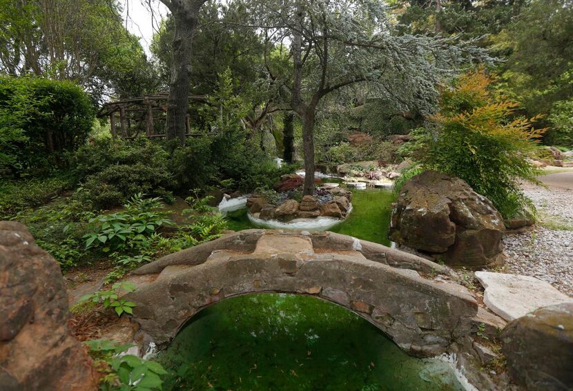 
Multiple water features, including ponds, fountains, waterfalls and canals (pictured here),...