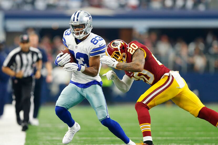 Dallas Cowboys wide receiver Terrance Williams (83) gets hit by Washington Redskins...