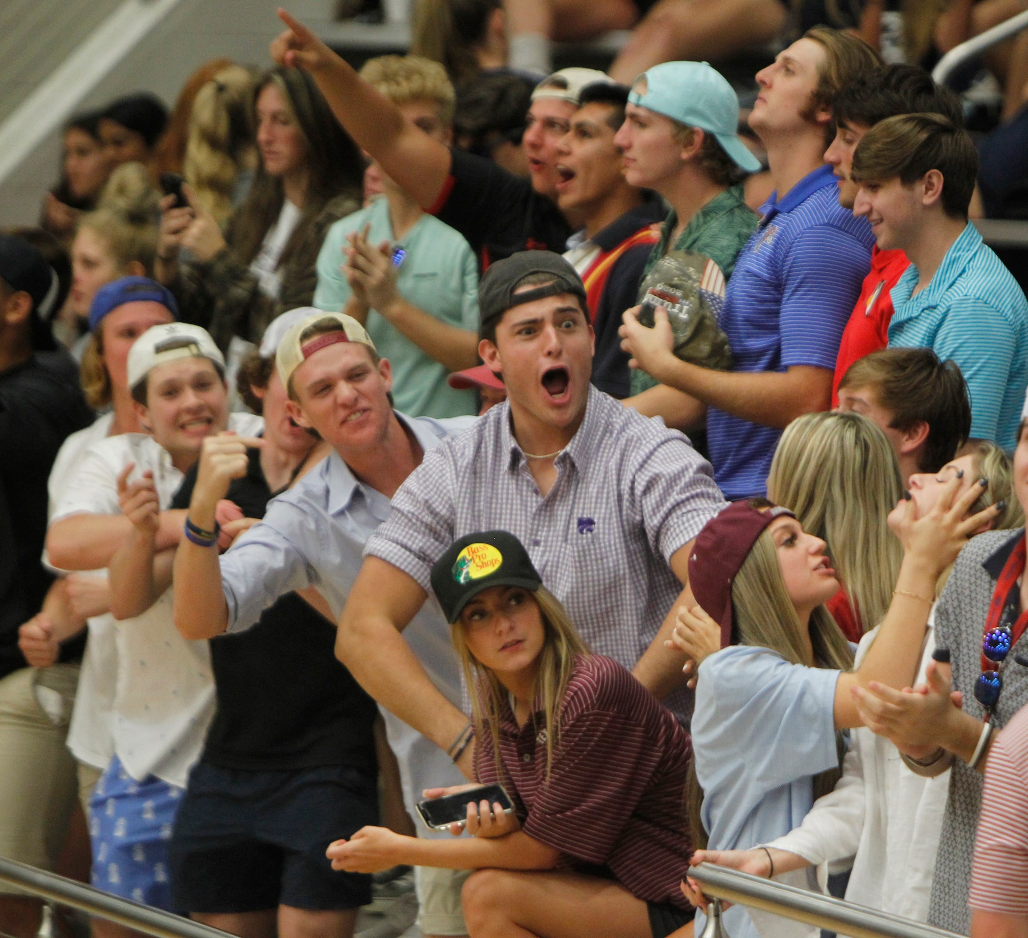 Flower Mound fans react from the student section after scoring a point during the 4th set of...