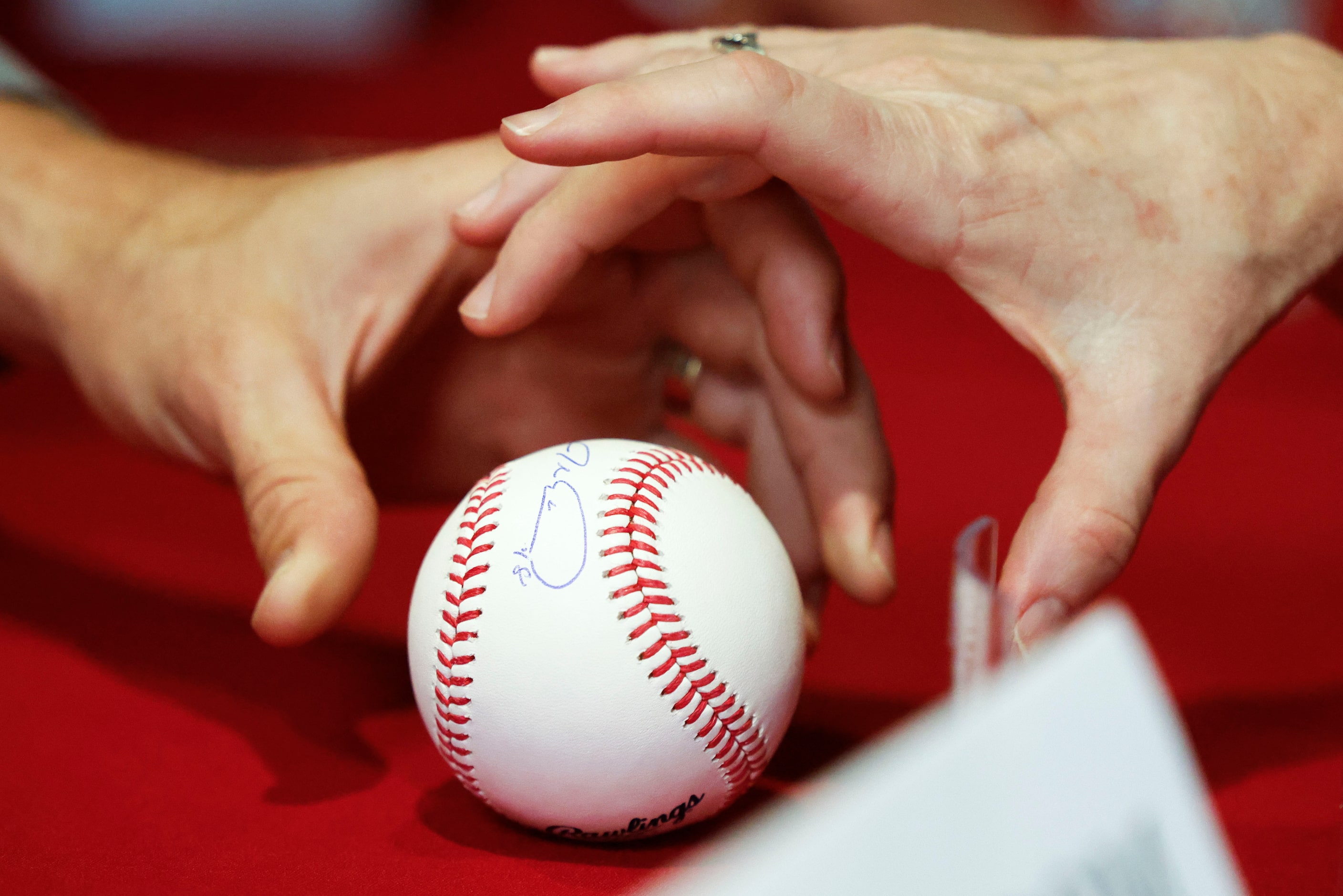 Texas Rangers’ Jacob DeGrom signs autographs to fans during Texas Rangers Fan Fest on,...