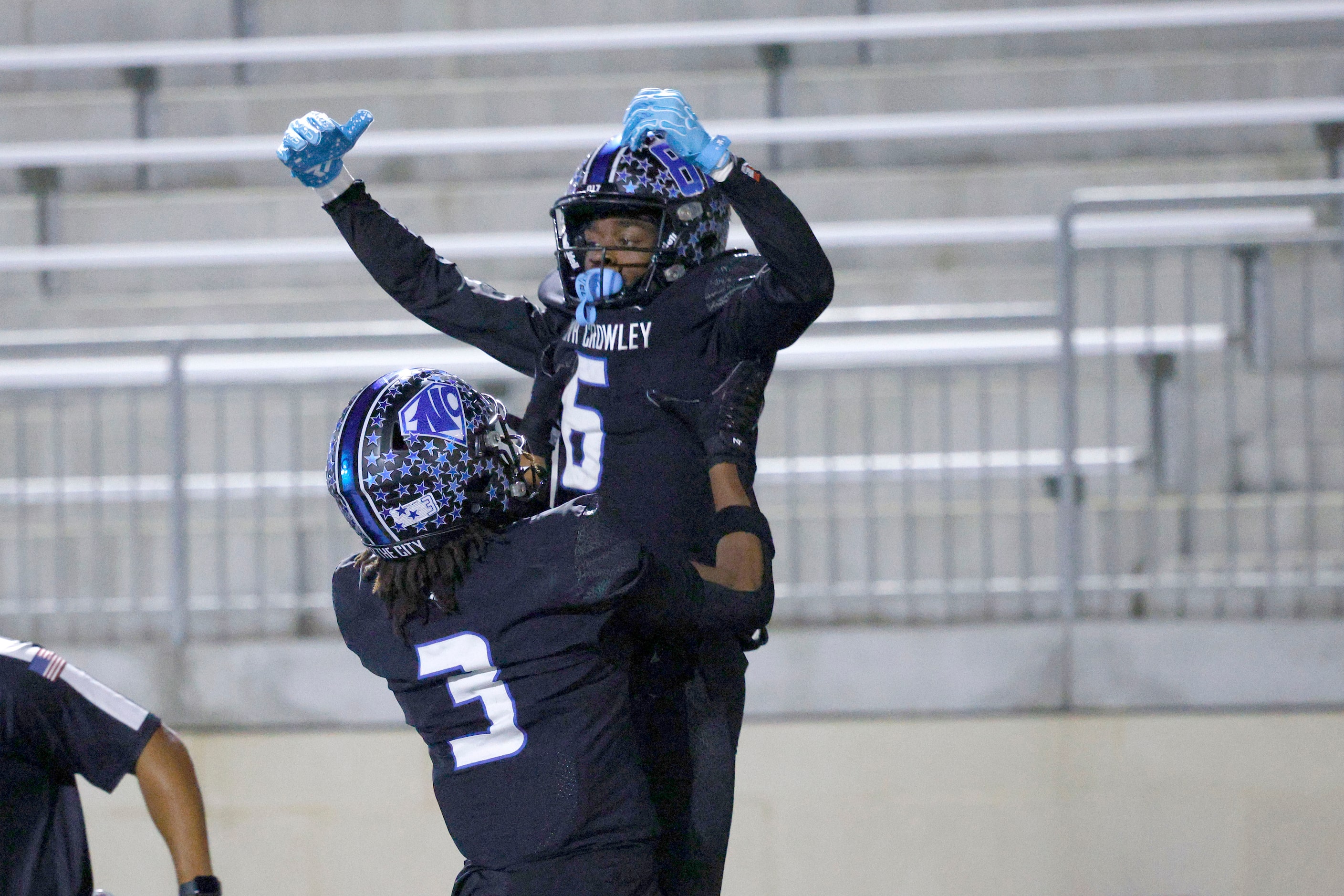 North Crowley's Quentin Gibson celebrates with his teammate North Crowley's Kevin Moore (3)...