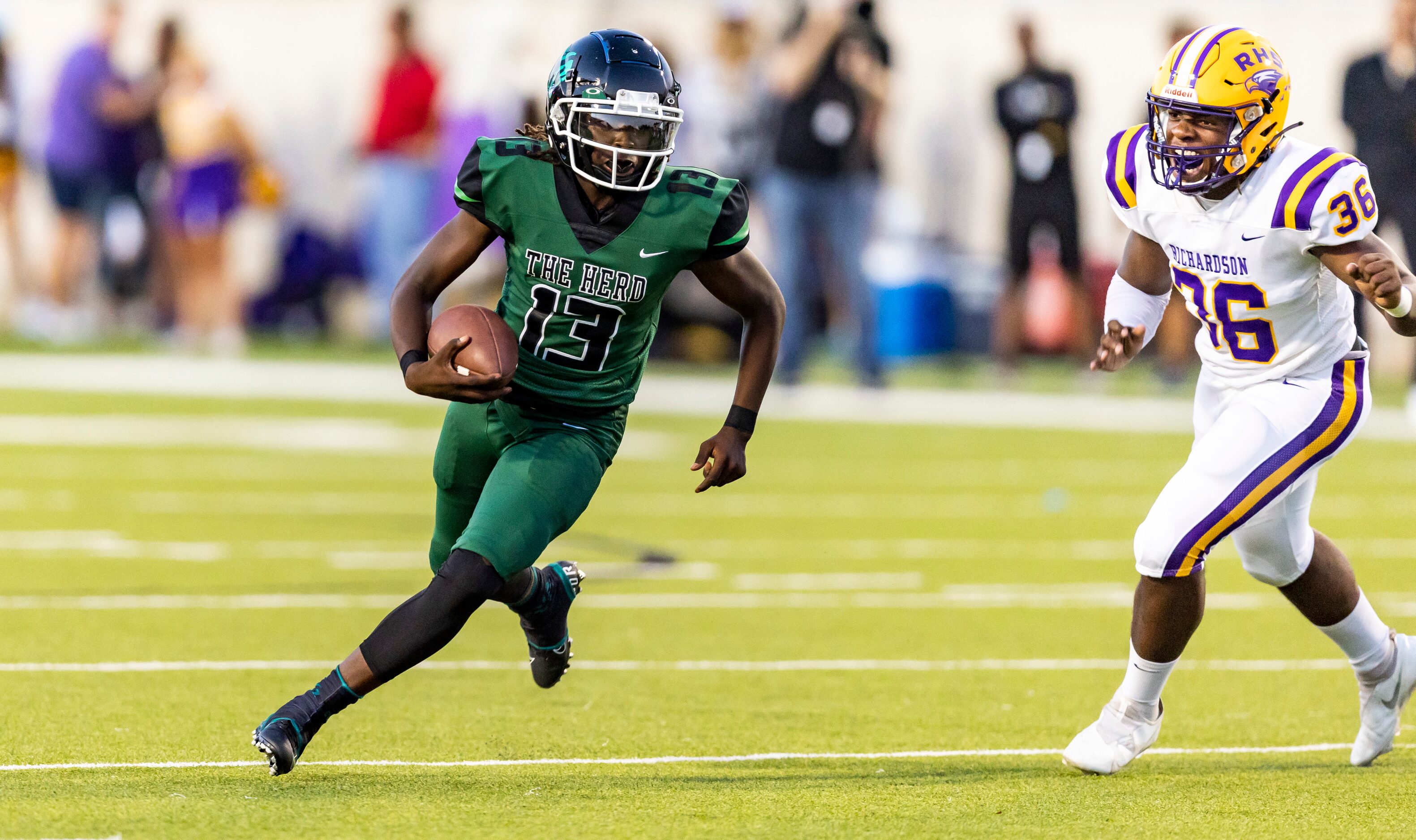 Berkner sophomore quarterback Demarcus Calhoun (13) evades Richardson junior Justin Murphy...