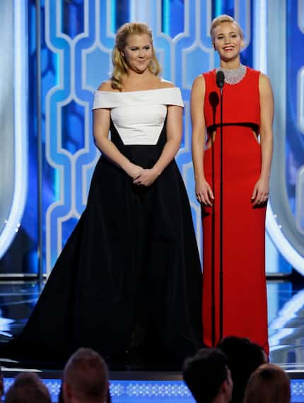 In this image released by NBC, Amy Schumer, left, and  Jennifer Lawrence introduce their...