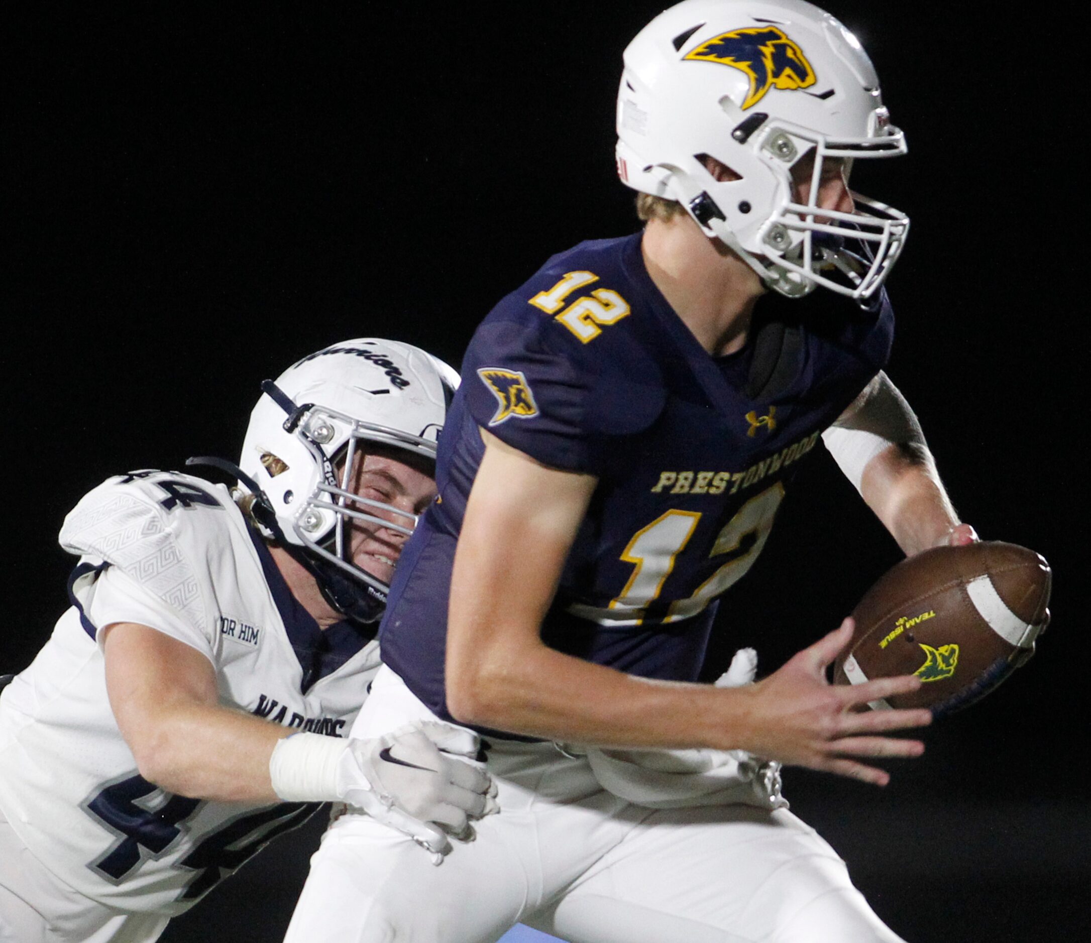 Plano Prestonwood Christian quarterback Luke Glass (12), right, couldn't escape the...