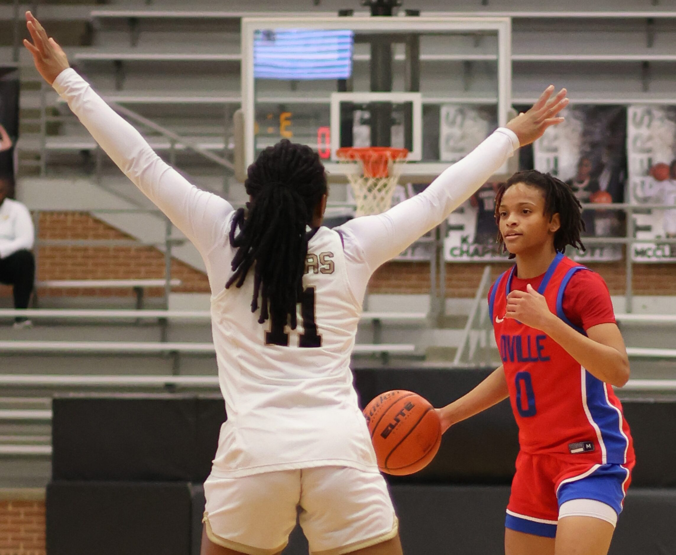 Duncanville guard Chloe Mann (0), right, works against the defense of Mansfield guard...