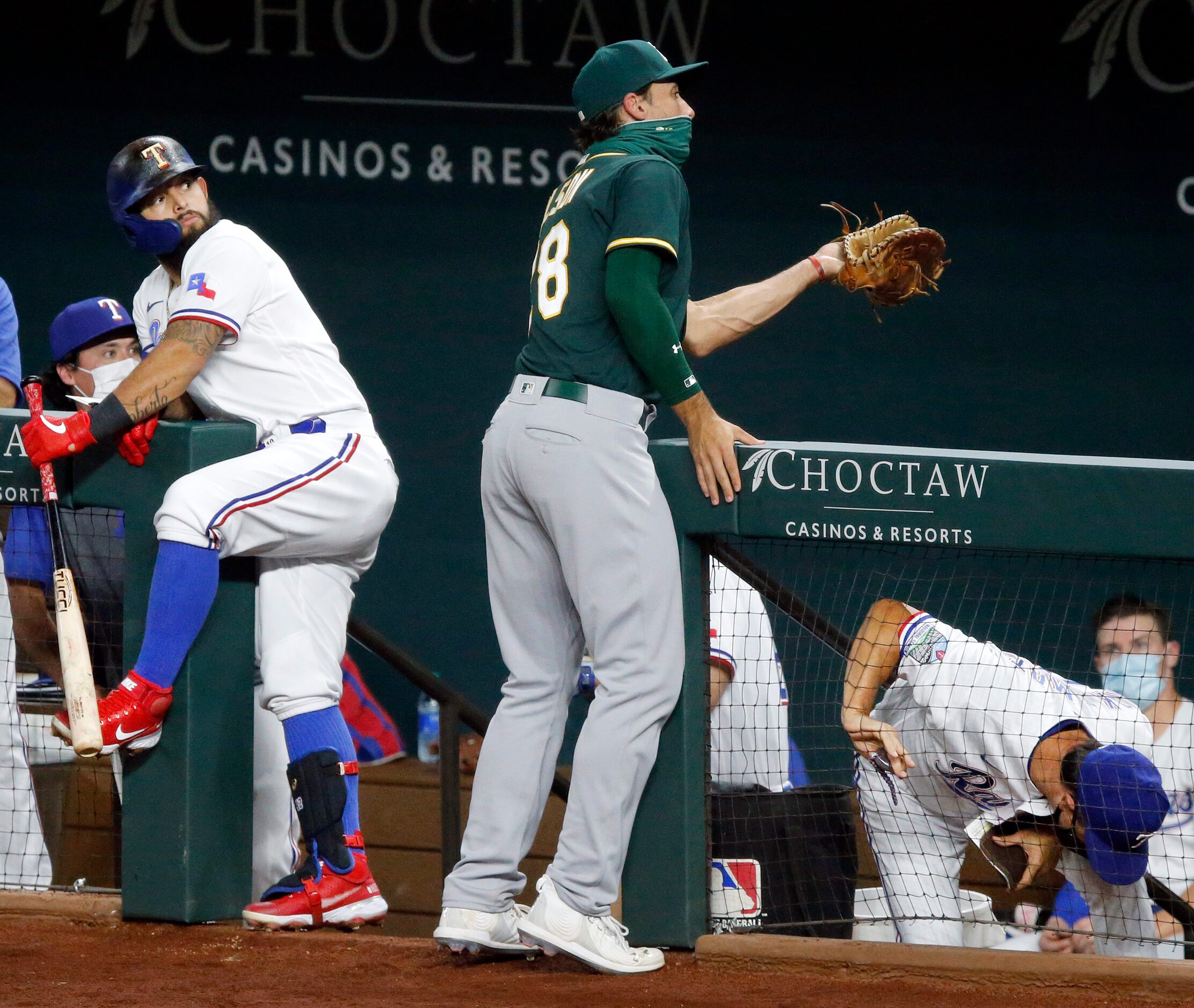 Oakland Athletics first baseman Matt Olson (28) catches a pop-up by Texas Rangers Jose...