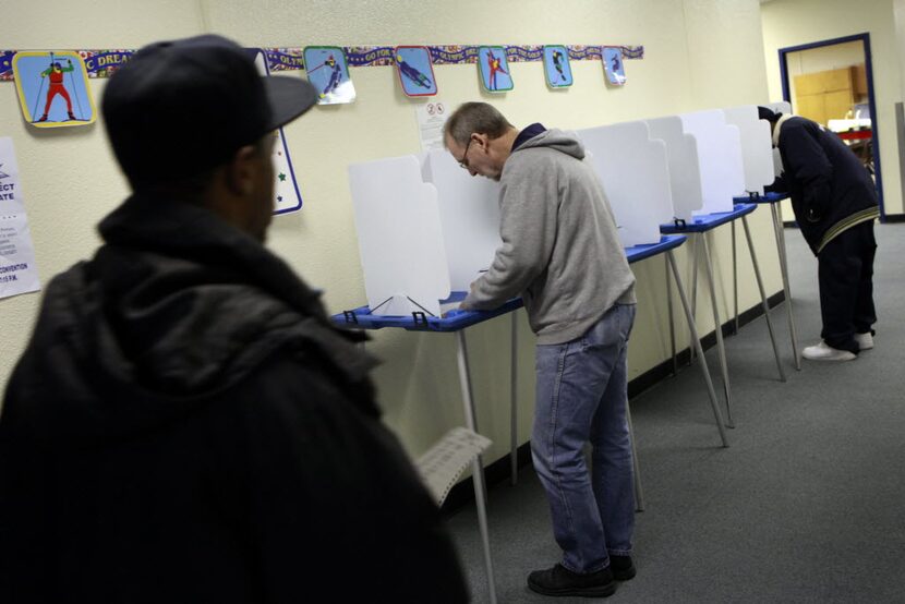 From left to right, Dartanian Lewis and Jay Green voted at the at the Martin Luther King,...