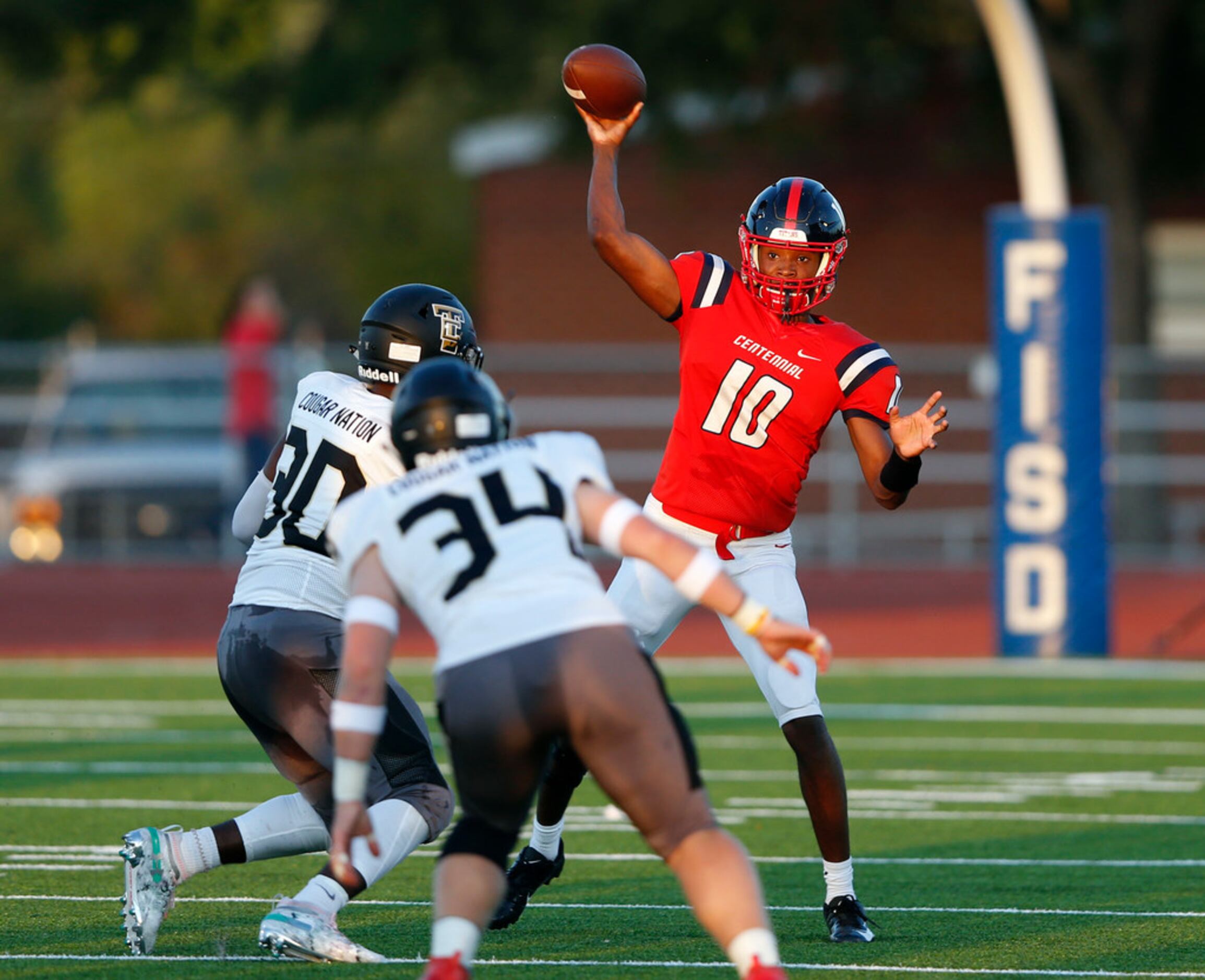 Centennial's Grayson Dayries (10) attempts a pass in a game against The Colony High School...