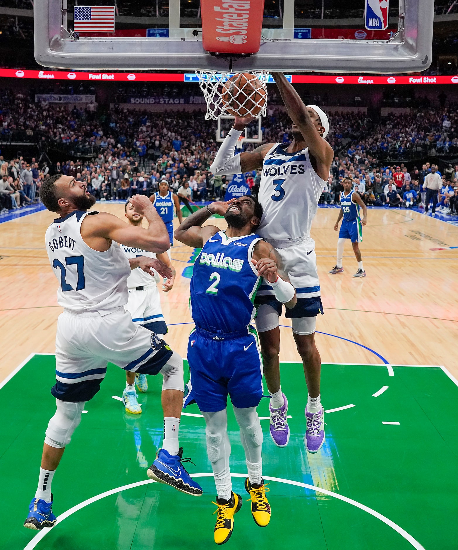 Dallas Mavericks guard Kyrie Irving (2) scores past Minnesota Timberwolves center Rudy...