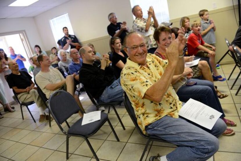 
Harold Megyesi, father of council member Lance Megyesi and Mayor Lorne Megyesi, cheers...