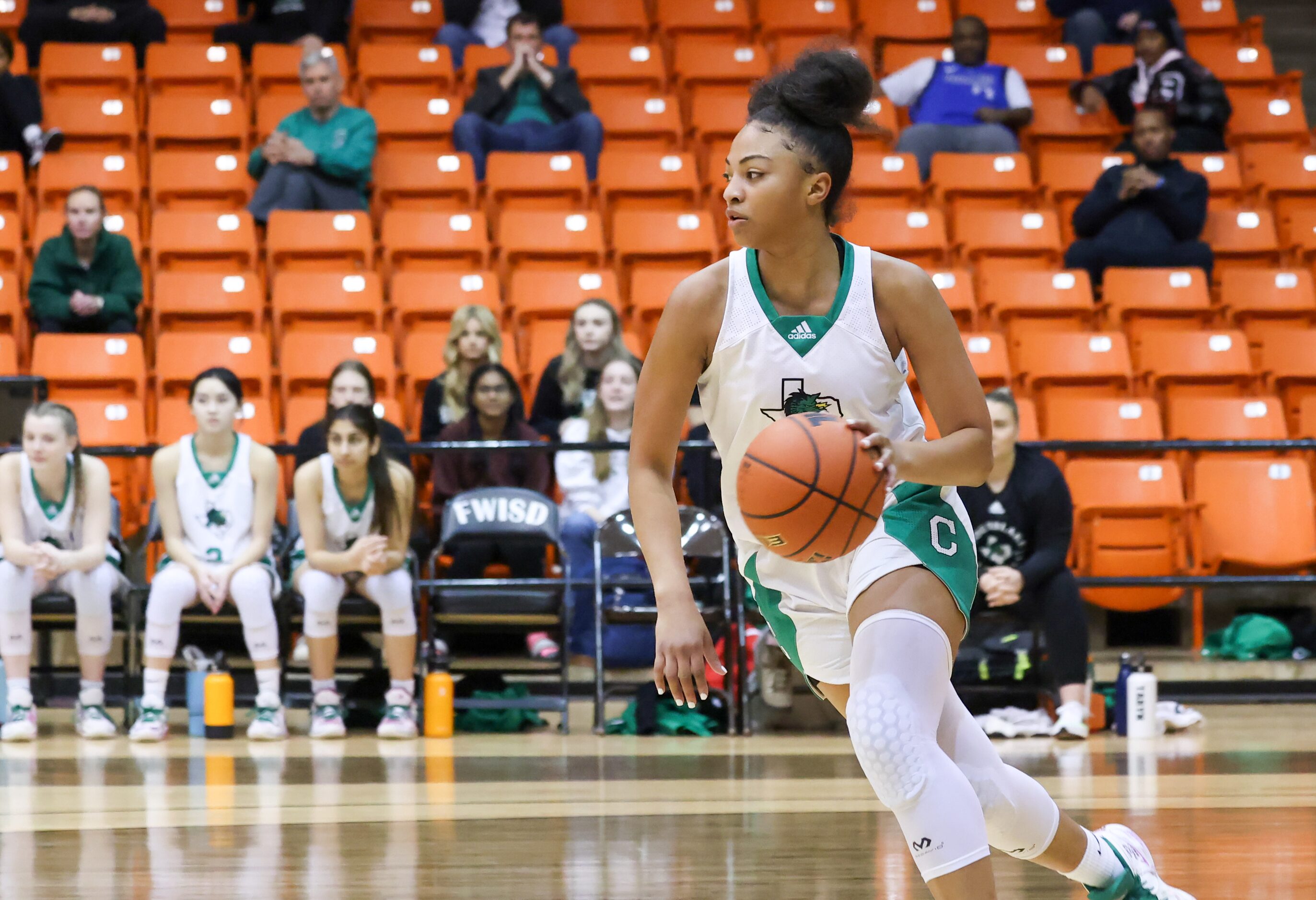 Southlake Carroll sophomore guard Milania Jordan (1) moves the ball down the court during a...