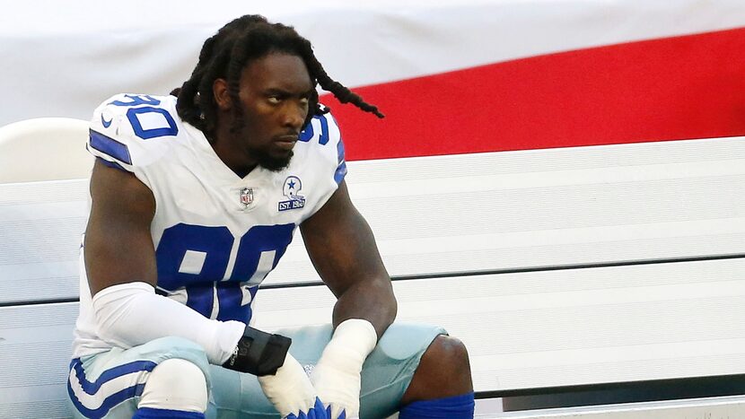 Dallas Cowboys defensive end DeMarcus Lawrence (90) on the bench at AT&T Stadium in...