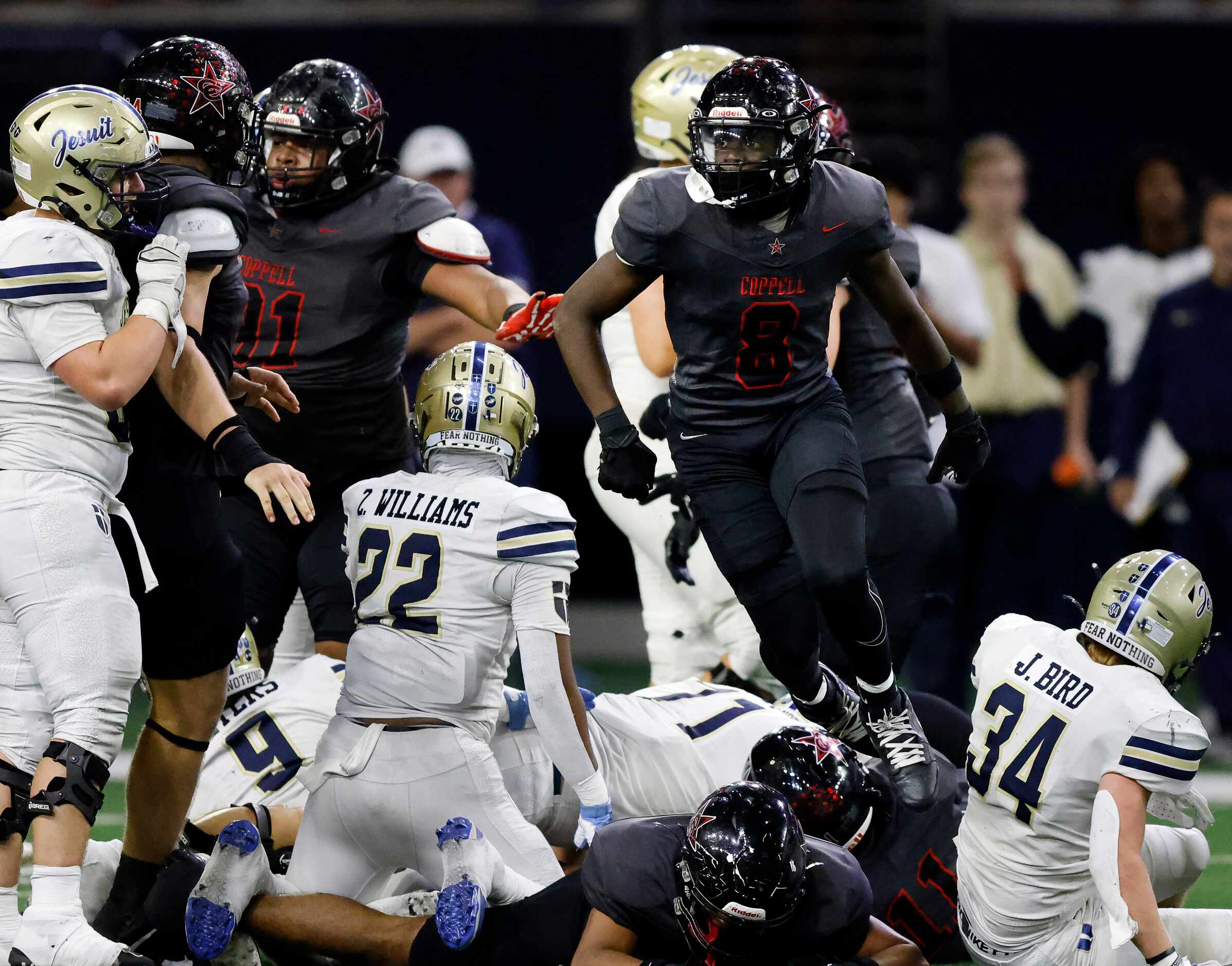 Coppell safety Jaden Adkins (8) and lineman Momeen Abbasher (91) celebrates their fourth...