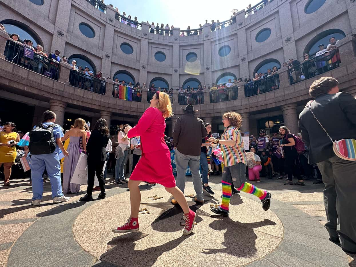 LGBTQ rights activists rally at the Texas Capitol in Austin, Texas on March 27, 2023.