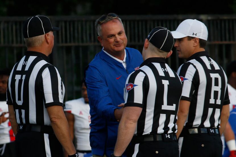 SMU Mustangs head coach Sonny Dykes greets referees before running a series of offensive...