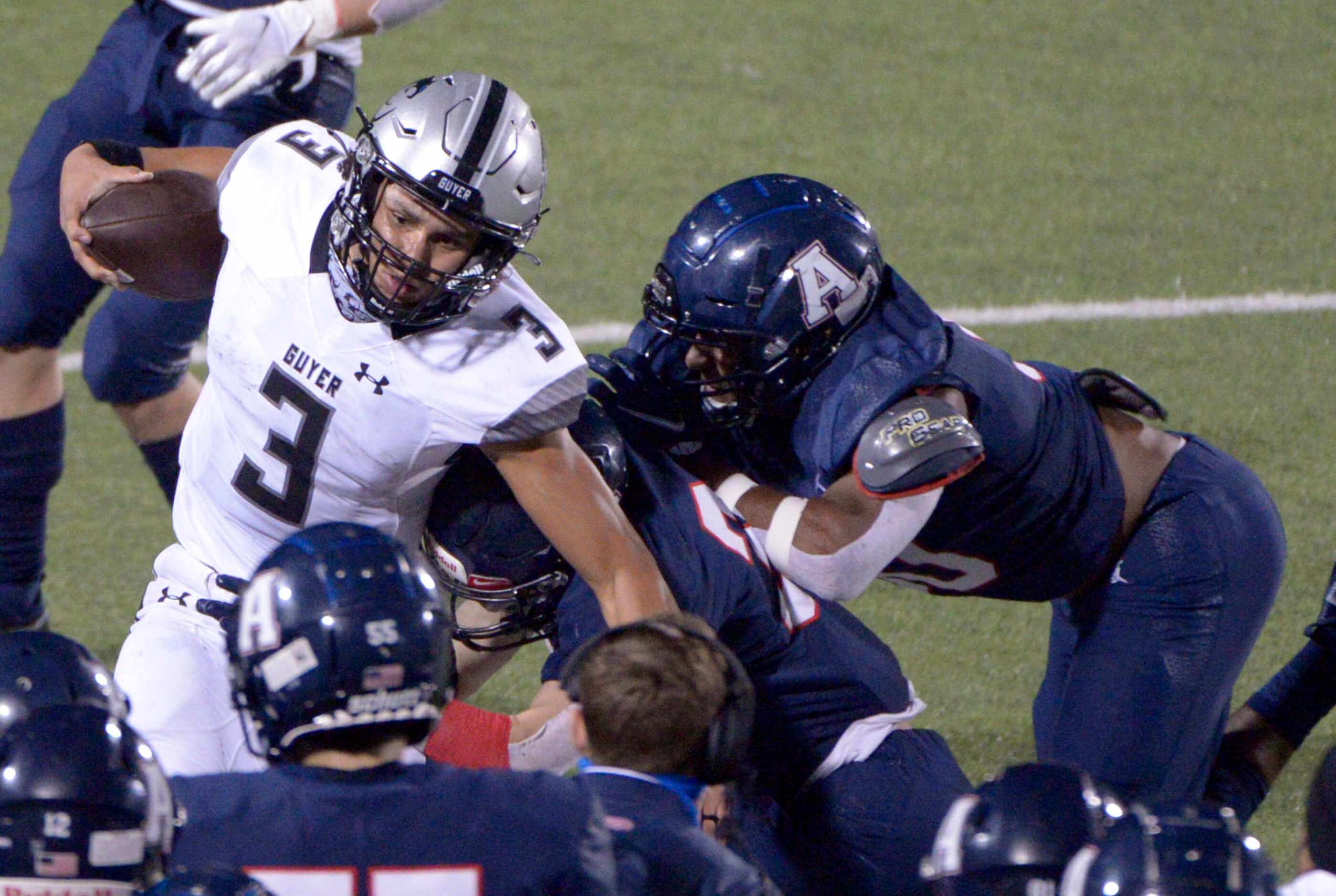 Deton Guyer quarterback Eli Stowers is tackled along the sidelines in the fourth quarter of...