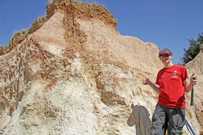 Dr. Kate Andrzejewski collecting rock samples from a Cretaceous fossil locality in north...